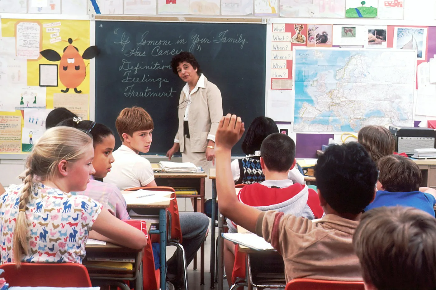 Teacher guiding a classroom rollout of AI tutoring tools