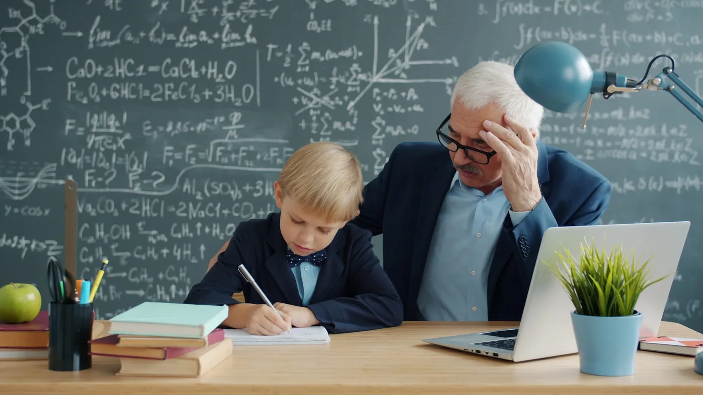 Teacher helping a student work through a difficult problem