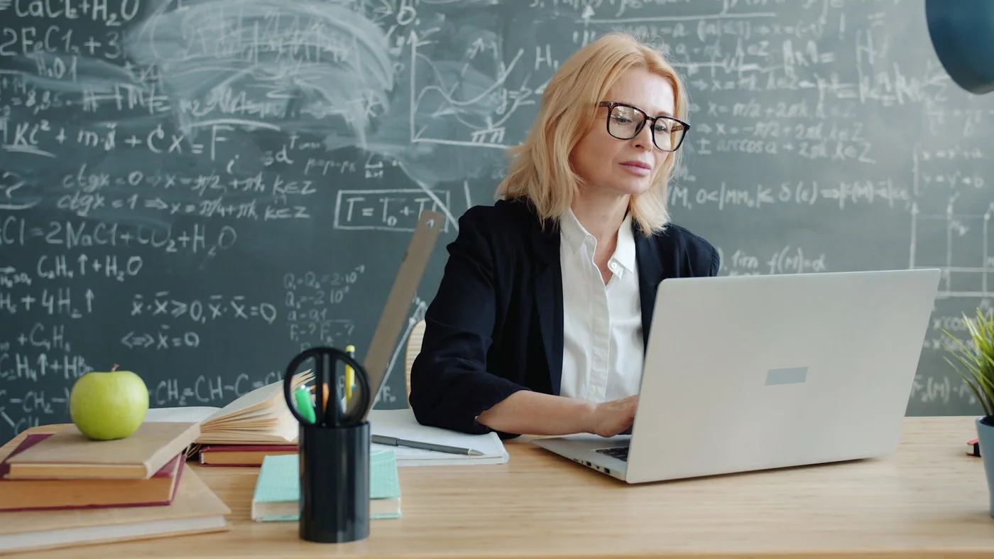 Teacher using a laptop to prepare personalized learning support